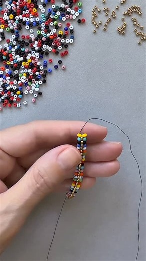 I just couldn’t resist playing with this new 8/0 Czech bead mix. It’s called Pop Art and it features black and white with lots bold colors. Plus, the beads all have a gorgeous matte finish that adds to the drama. While these colors make a statement, pairing it with gold gives it a more sophisticated look. When finished, this bracelet will pair beautifully with a gold chain bracelet. What would you make with this mix? Available now at www.thebeadmix.com 🛍️ | The Bead Mix