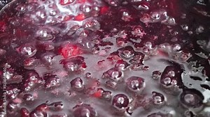 Making homemade jam : Boil the aronia, peach, sugar and lemon juice. Aronia is a superfood, also called chokeberry or king's berry.