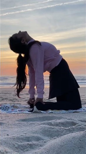 🧘‍♀️ Practicing flexibility - yoga by the beach 🏖️