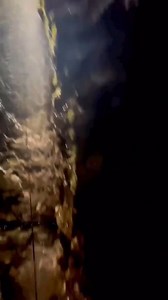 Discover the breathtaking depths of Gaping Gill, where stunning waterfalls cascade into a 105-meter descent 🌊 Gaping Gill is a natural cave system in North Yorkshire, England. It is one of the most recognizable landmarks on the southern slopes of Ingleborough, a 105-meter deep pothole with the stream Fell Beck flowing into it. After falling through one of the largest known underground chambers in Britain, the water disappears into the bouldery floor and eventually resurfaces adjacent to Inglebo