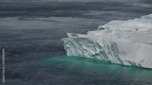 Antarctic landscape with mountains and icebergs. The beauty of the nature of planet Earth.