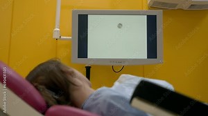 Patient examination at the pregnancy ward in the modern maternity hospital. Examination of the pregnant female patient stomach. Ultrasound examination of the woman patient during pregnancy. Inspection