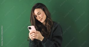 Shock, omg angry woman with phone on green background read notification, announcement and fake news. Mad annoyed female with wtf face write message in social media, gossip and online post.