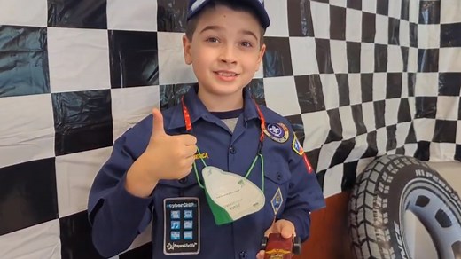 Third-grader all smiles after big Pinewood Derby win