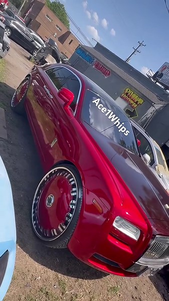 Lee’s first in the world candy red Rolls-Royce Ghost on 30” DUB Opera Floaters