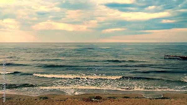 Dark storm clouds, rain and sea surface at sunset. Nature. Natural background. Stormy weather. Storm at sea.