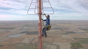 Changing a light bulb at the top of a 1500-foot TV tower