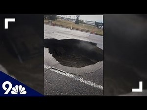 WATCH: Car falls into 'massive' sinkhole