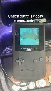 Gameboy Color shell *almost* fits a full 2.5” LED screen. Wire up the +/- to a backup cam wiring kit
