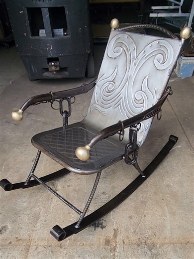 Leaf springs don’t retire, they evolve. I built this rocking chair was built from the bones of machines that already lived a hard life. Truck leaf springs reborn as rockers. Antique horse yokes reshaped into armrests. Swiveling horseshoe cup holders. Vintage nautical chain. Hand-formed, bead-rolled steel panels instead of fabric upholstery. Nothing off the shelf. Nothing decorative for decoration’s sake. Every piece was either repurposed or hand-shaped specifically for this chair. Functional art