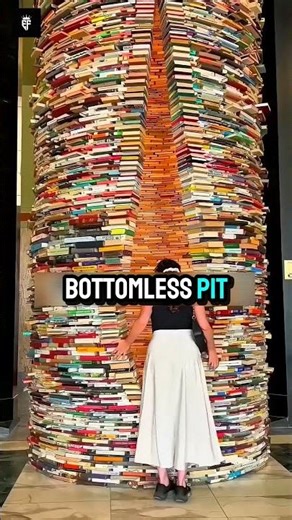 This library has a book tower.