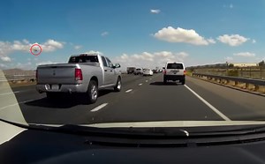 Dashcam Footage Shows Pilot Ejecting Moments Before F-16 Fighter Jet Crashes Into a Warehouse