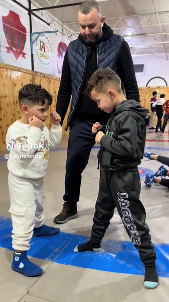 Children Learning Martial Arts Techniques in Training