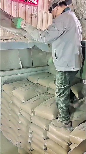 Factory Cement Bag Loading: Skilled Worker Stacking Perfectly