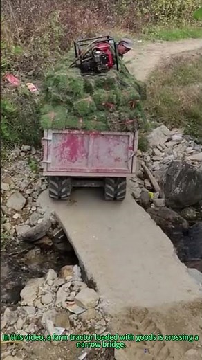 Farm Tractor Crossing Narrow Bridge: Agricultural Skill and Safety in Action