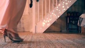 An woman take off her dress and drop it on floor. woman came home