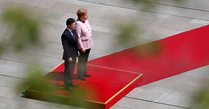 Germany's Angela Merkel shakes uncontrollably at ceremony, says she's OK