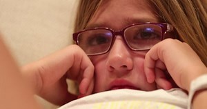 clip-1032978251-closeup-little-girl-face-watching-scary-movie