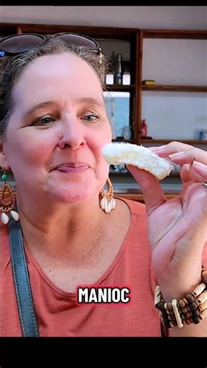 Trying manioc, its like a pudding with coconut you can sort of hold in your hand 🤣