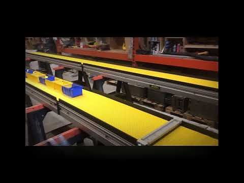 Reverse Direction Conveyor With Accumulation Stop Bar