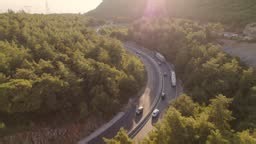 Tracking camera movement capturing a container truck on a mountain...