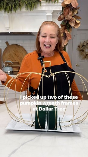 Grab a couple of Dollar Tree pumpkin wreath frames and make a centerpiece for your fall or Thanksgiving table! #flowerarrangement #fallcenterpiece #dollartree | Celebrate & Decorate