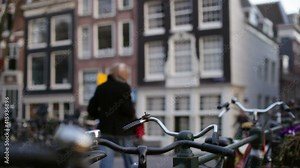 Amsterdam bicycles and people walking and riding bikes