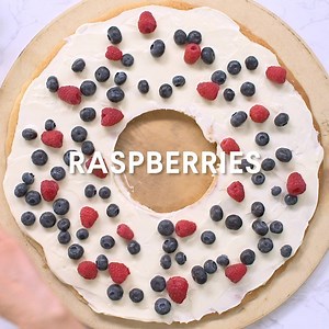 This elegant and tasty Christmas wreath fruit cookie cake looks just like the real one hanging on your door. See the full recipe: https://aol.it/2A8pjZs | In The Know Cooking