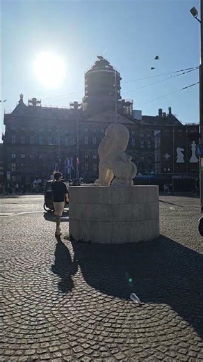 Dam Square, Amsterdam, on a summer's Sunday afternoon.