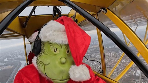 Grinch joins Santa on helicopter ride to take Christmas spirit to the sky
