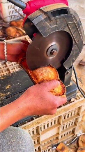 Cutting large brown seeds into thin pieces using a small electric circular saw machine