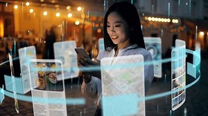 clip-1106370087-incredibly-beautiful-asian-woman-using-augmented-reality