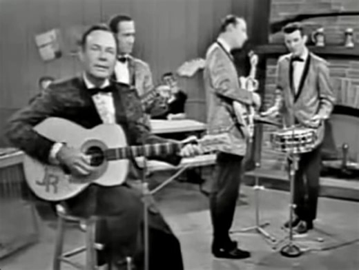 Jim Reeves sings short versions of "Four Walls", "Tennessee Waltz" and "He'll Have To Go" at the Pet Milk Grand Ole Opry. - Music Legend