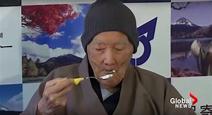 Oldest man on earth celebrates his new Guinness World Record title with a piece of cake