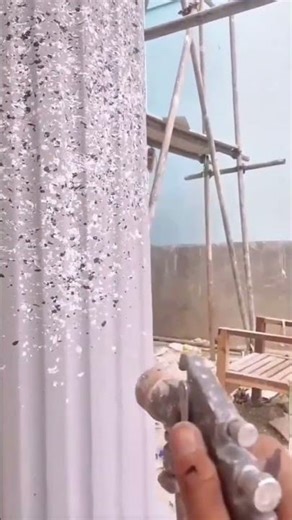 Decorative Spray Painting on a Round Building Column for a Beautiful Granite Stone Effect