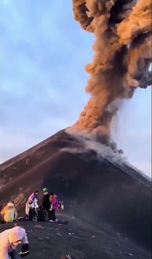 WILD FOOTAGE: Exploding Volcano Rocks CRASH Down Inches From Tourists!