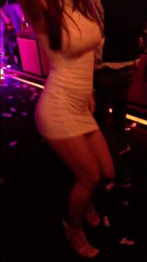 hot girl dancing in a mini dress in the club