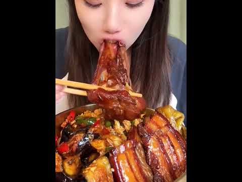 Eating braised pork belly and fried egg with rice