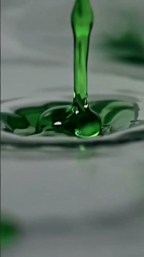 Free AI Footage! Mesmerizing Slow-Mo Green Ink Drop in Water
