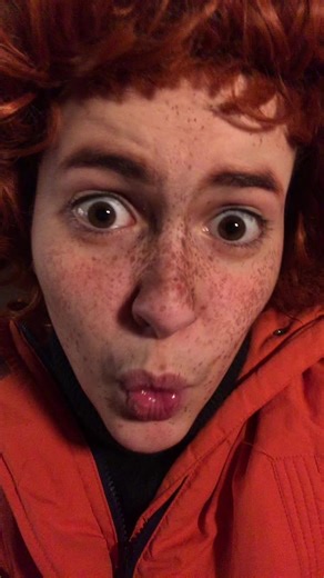 Stylish Orange Jacket for Reddish Curly Hair