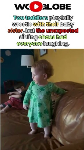 Playful sibling chaos as two toddlers wrestle with their baby sister