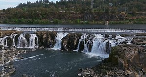 Willamette Falls Oregon City Oregon. It is the largest waterfall in the Northwestern United States by volume, and the seventeenth widest in the world. Horseshoe in shape, it is 1,500 feet wide.