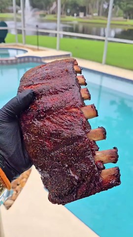 Hanging ribs inside a drum smoker