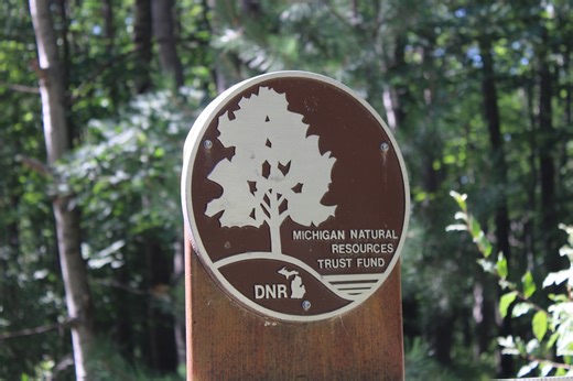 Whitmer signs $41.8M conservation bill, renews environmental fees