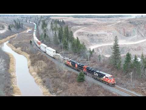 Awesome Aerial 4K View! Fast Stack Train CN 120 passing Rock Quarry approaching Memramcook, NB