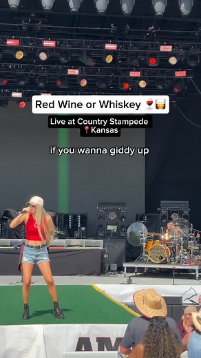 I can be your red wine or whiskeyyyy 🎶🍷🥃 Live from @heartlandstampede 🎸 @tavisjstanley 🥁 @madzrocks_ #CountryMusic #LiveMusic #CountryFestival | Alli Walker