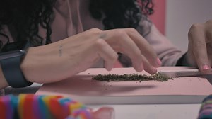 Woman filling a joint - Free Stock Video