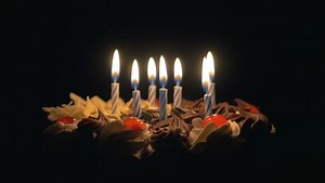 4k - Blowing out birthday candles on delicious chocolate cake
