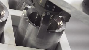 Industrial robot arm in factory. Robotic arm moves metal details in the factory