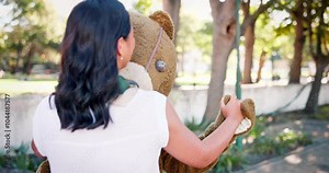 Costume, business and woman dance outdoors with teddy bear for promotion or entertainment with company mascot. Female person, funny or ridiculous outfit for comedy or humor, quirky and hilarious.